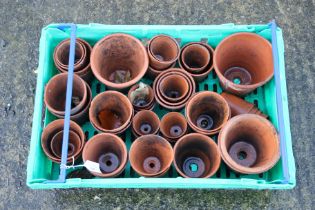 A collection of terracotta plant pots.