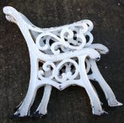 Two pairs of cast metal garden bench ends. Painted white, H77.