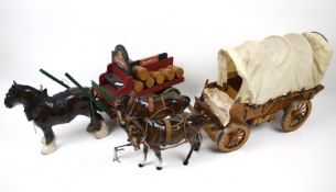 Three ceramic horses and two wooden wagons. Including two Beswick examples, Max.