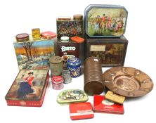 An assortment of vintage advertising tins and metalware.