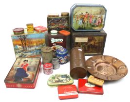 An assortment of vintage advertising tins and metalware.