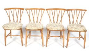 A set of four Ercol mid-century dining chairs.