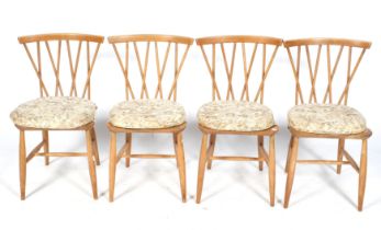 A set of four Ercol mid-century dining chairs.