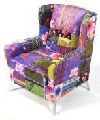 A contemporary lounge wingback armchair. With multi coloured upholstery.
