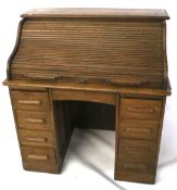 A Victorian oak roll top clerk's desk.