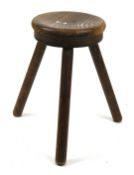 A vintage milking stool.