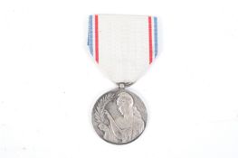 A Reconnaissance Francaise medal of French Graitutde. With ribbon.