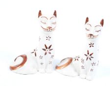 A pair of mid-century seated ceramic cats.