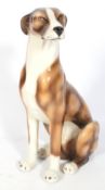 A life size ceramic dog figure named 'Jason'.
