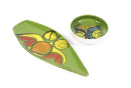 Two mid-century Poole Pottery Delphis items. Comprising a green ground bowl and shield shape dish.