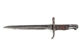A bayonet. With an illegible emblem to handle and possible Islamic-style script to top of blade.