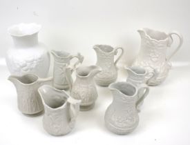 A collection of Parian ware. Including a Kaiser vase, Portmeirion jugs, etc.