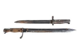 Two German bayonets. The longer marked 'Waffenfabrik Mauser AG Oberndorf' to top of blade. L49.