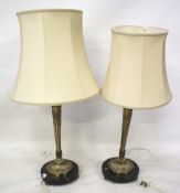 A pair of 'Classical' style gilt metal lamps.