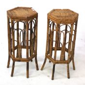 A pair of bamboo plant stands.
