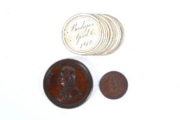 An early 19th century Duke of Wellington Victories bronze medallion box with paper inserts and coin.