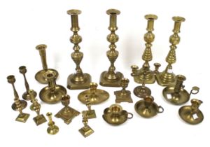 A collection of brass candlesticks. Of various designs, including pairs, Max.