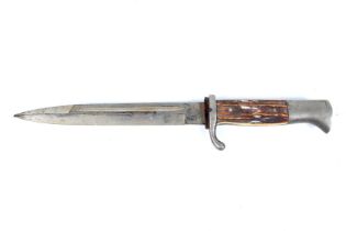 A German bayonet. Marked ROBERT KLASS, SOLINGEN to blade. Imitation bone and metal handle. L32.