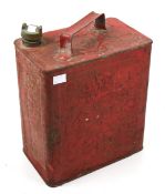 A red vintage 'Shell' motor oil can.