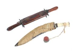 A decorative kukri dagger and an Indian knife set.