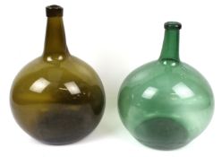 Two vintage globular shaped glass bottles. One green, one brown. Max.