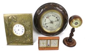 Two clocks and two oak cased barometers.