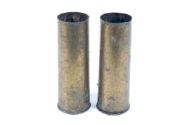 A pair of WWII brass shell cases.