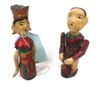 Two circa 1950, Vietnam Polychrome 'Draw-string' articulated wooden figures.