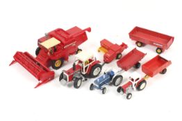A collection of Britains Farming vehicles and implements.