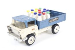A Tri-ang tin plate milk truck. Painted white and blue complete with plastic milk bottles.