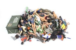 A mixed collection of Action Man figuresa and accessories.