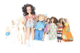 An assortment of nine vintage dolls. Noting Barbie examples etc, unboxed.