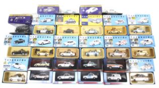 A collection of 24 diecast Police cars.