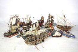A collection of wooden model ships. Mainly comprising sailboats noting lifeboat etc, qty 15 approx.