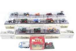 A collection of 1:32 scale vintage tractors.