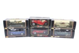 A collection of six 1:18 scale diecast cars.