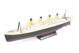 A 1:325 scale model of the RMS Titanic. Radio control capability in original box.