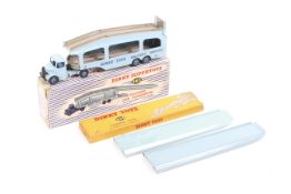 A Dinky Pullmore Car Transporter with Loading Ramp. Nos. 982 and 994, both boxed.