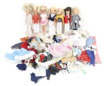 A collection of Sindy comprising seven dolls and a large collection of clothes and accessories.
