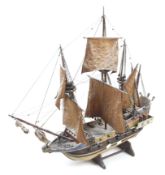 A wooden model of an Elizabethain war ship.