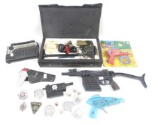 A collection of Man from Uncle toys and accessories. Including toy guns, badges etc, some in case.