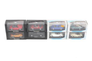 A collection of eight Minichamps diecast cars.