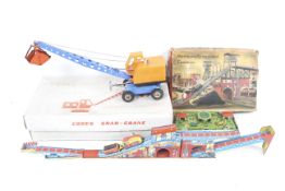 A collection of mid 20th century tin plate toys.