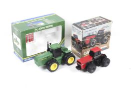 Two ERTL 1:32 scale battery operated tractors.