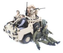A collection of Action Man figures and vehicles.