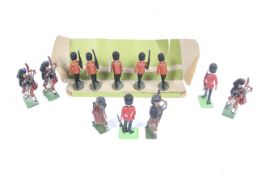 A group of five Britains Scottish marching band lead figures.