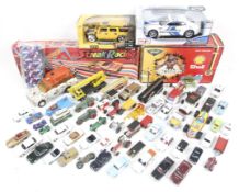 A mixed collection of diecast cars.