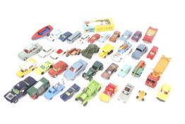 A collection of diecast vehicles and figures.