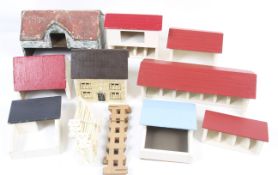 A collection of 1:32 scale wooden farm buildings.