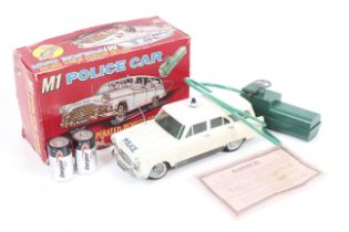 A Marx Mk 1 police car. Battery operated remote control, boxed.